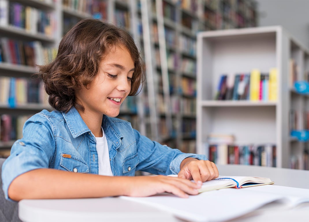 child-reading-book-in-library child-reading-book-in-library
