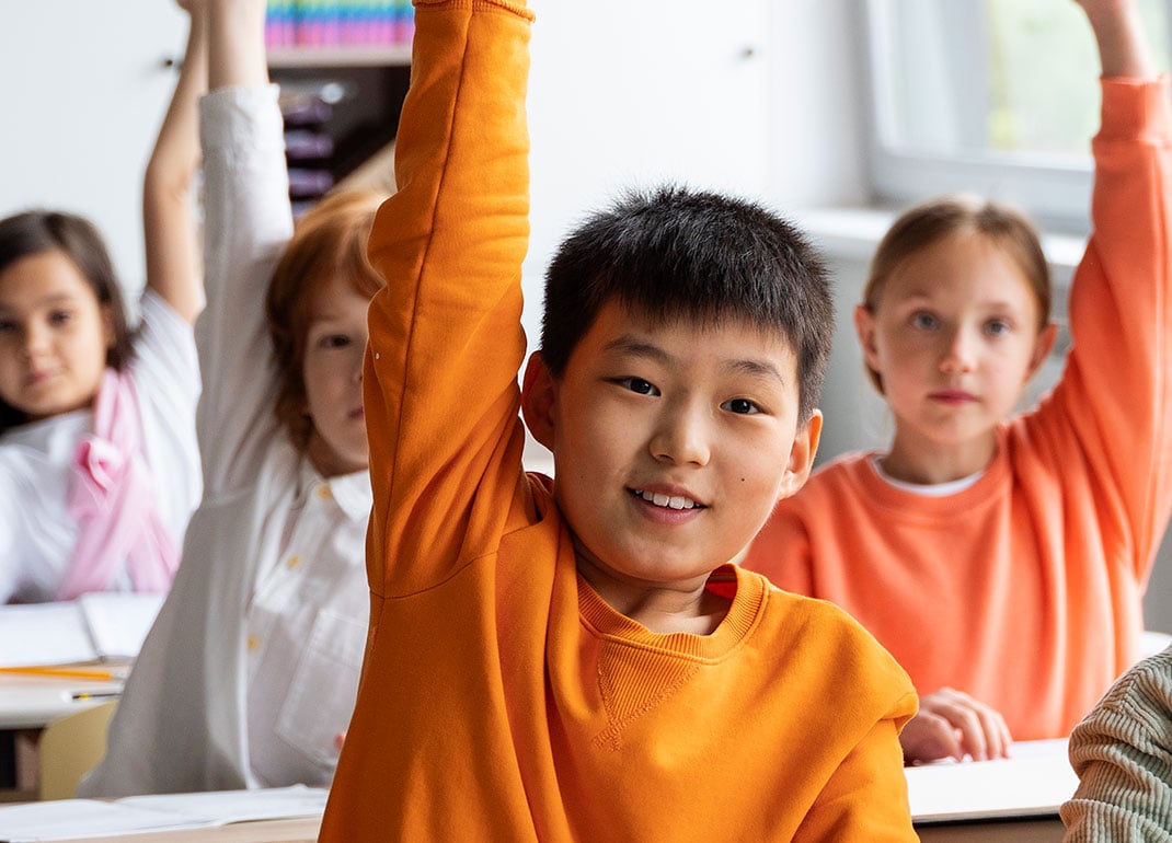 kids-raising-hands-in-class kids-raising-hands-in-class